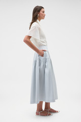 Profile view of model wearing the Oroton Basque Detail Skirt in Pale Frost and 98% cotton and 2% spandex blend fabric for Women .
