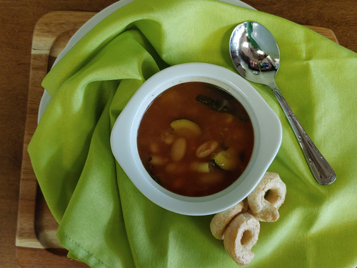 Fresh In-House Minestrone Soup; made with fresh zucchini, carrots, celery, spinach, garlic, basil, and onions.  EVOO from Two Olive Trees, cannellini beans, whole peeled tomatoes, ditalini pasta all gently simmered in chicken broth.