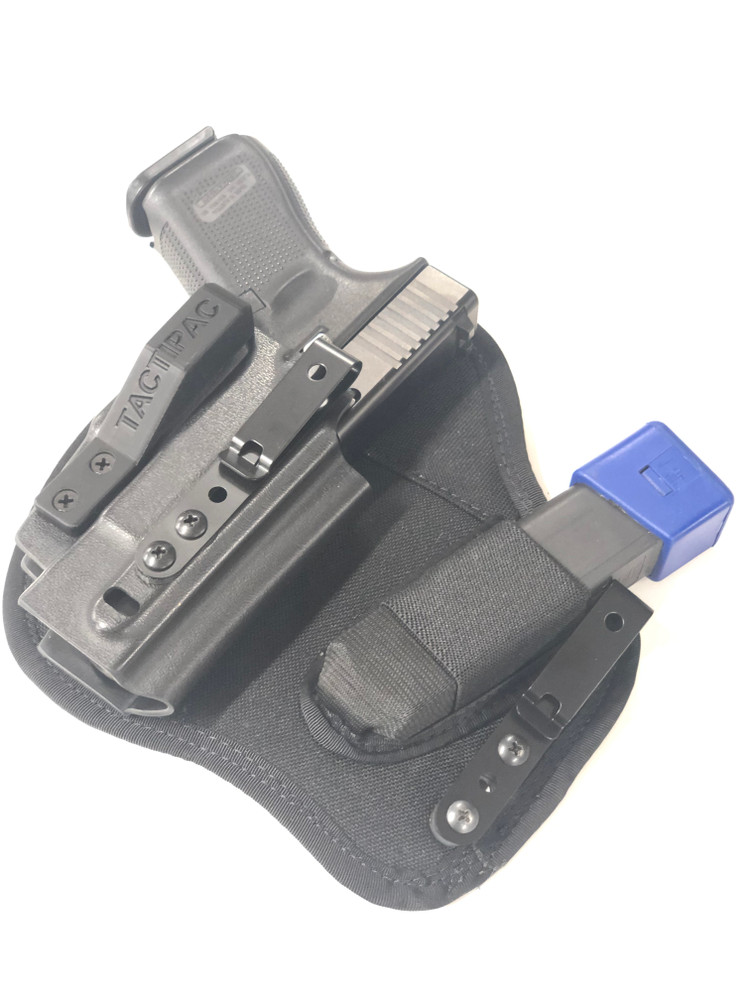 Side angled view of Glock 19 and extra magazine holstered in the Max X dedicated appendix carry holster. 