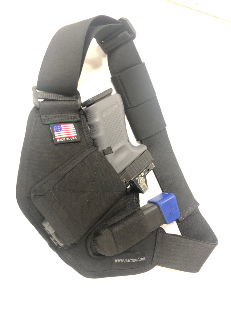 Glock 19 with optic and extra magazine holstered in the ACS Holster.