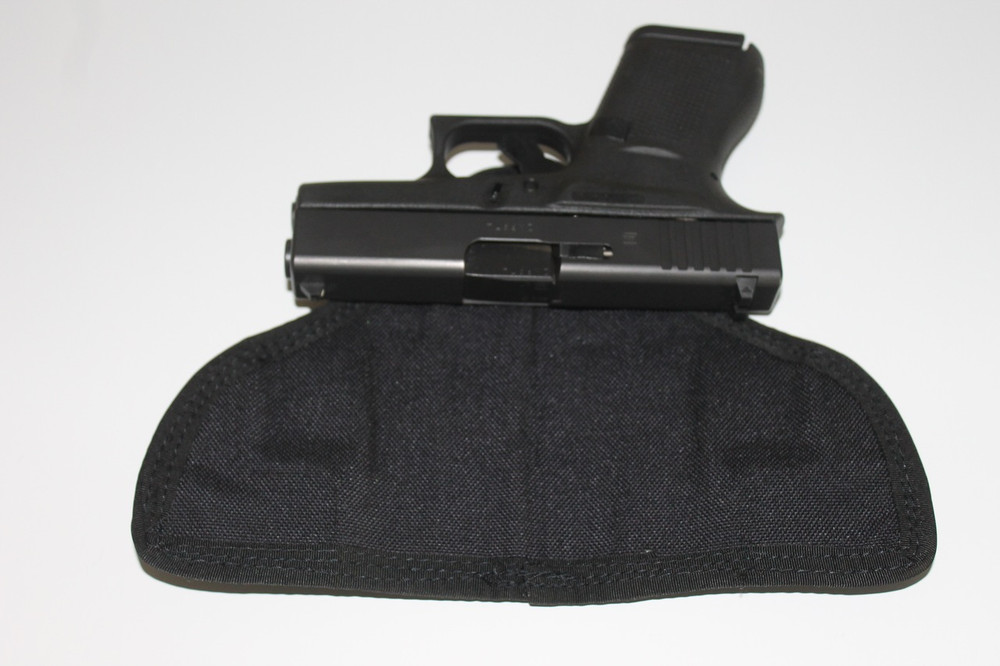 Cutaway PocketPac Pro showing the closed cell foam and Cordura interior formed to the specific gun. 