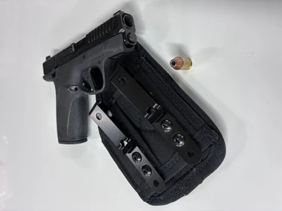 S&W Bodyguard 2.0 .380 shown with self defense round and Micro AFx IWB Concealed Carry Holster