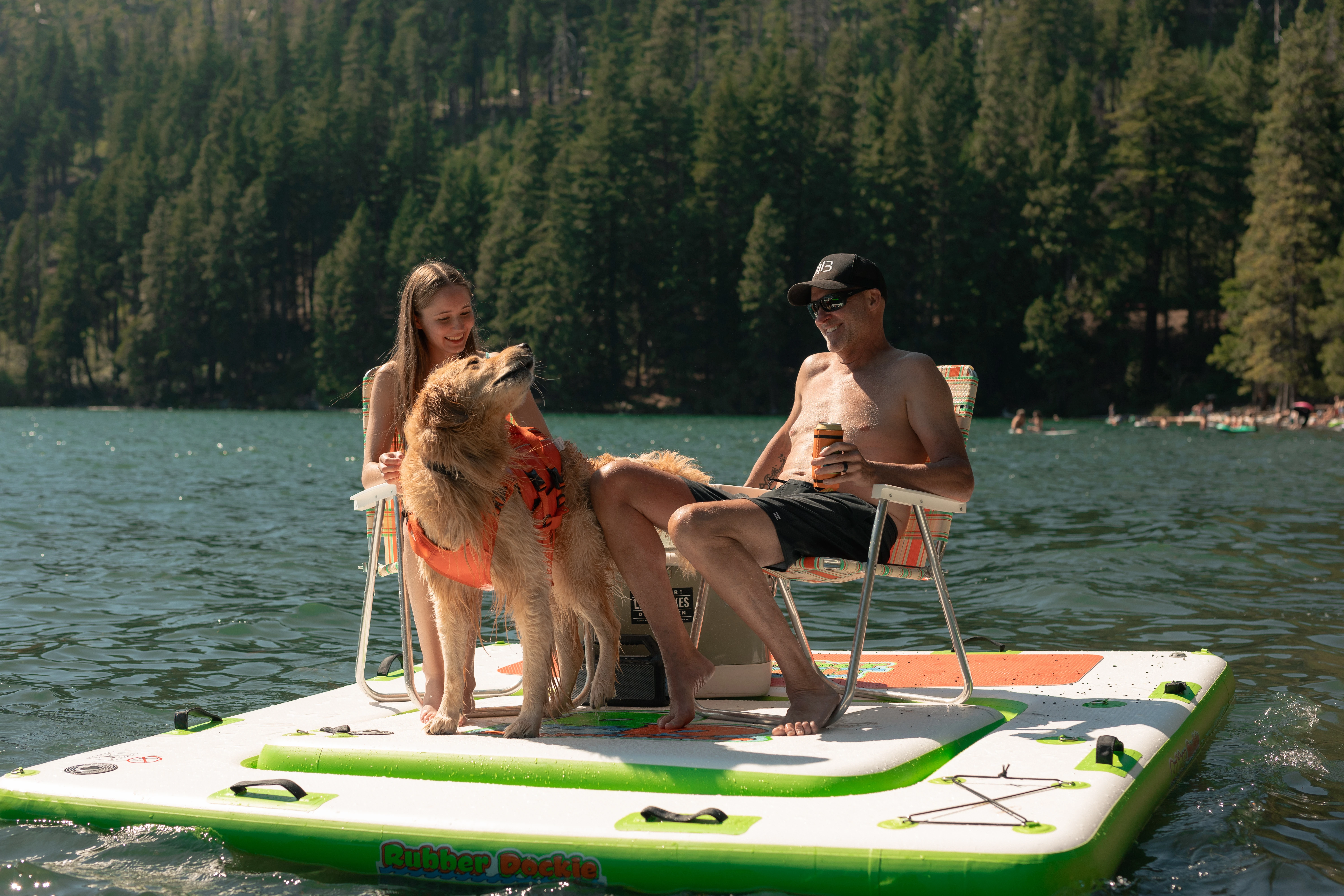 Family and dog relaxing on the Rubber Dockie Hybrid 2-in-1 floating island