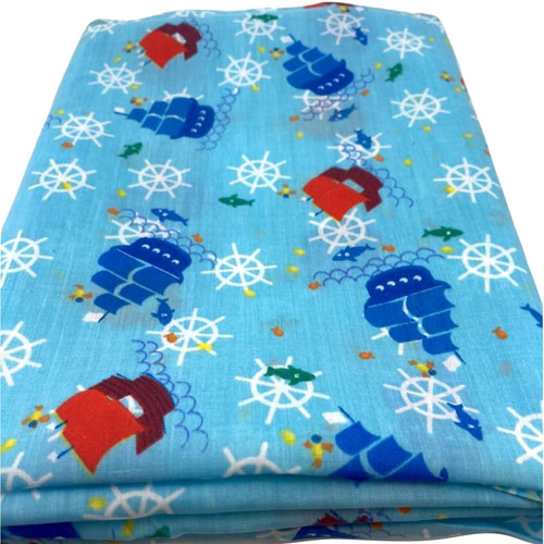 Turquoise blue polycotton fabric with sailing ships in blue and red printed at sea.