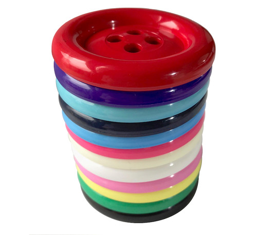 Very large round nylon buttons approximately 65mm diameter. Available in a wide selection of colours.