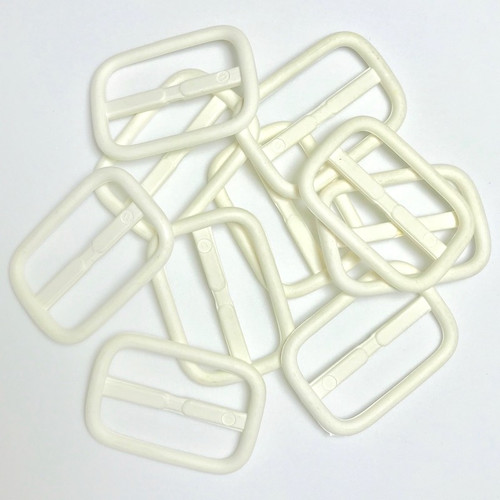 White self cover slider buckle, packet of 20 buckles.