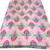 Pink cotton with printed flower and green foliage. Stunning design.