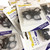 Close up view of the bulk offer of small black decorative cafe curtain clips. Each packet has 5 clips there are 10 packets in total.