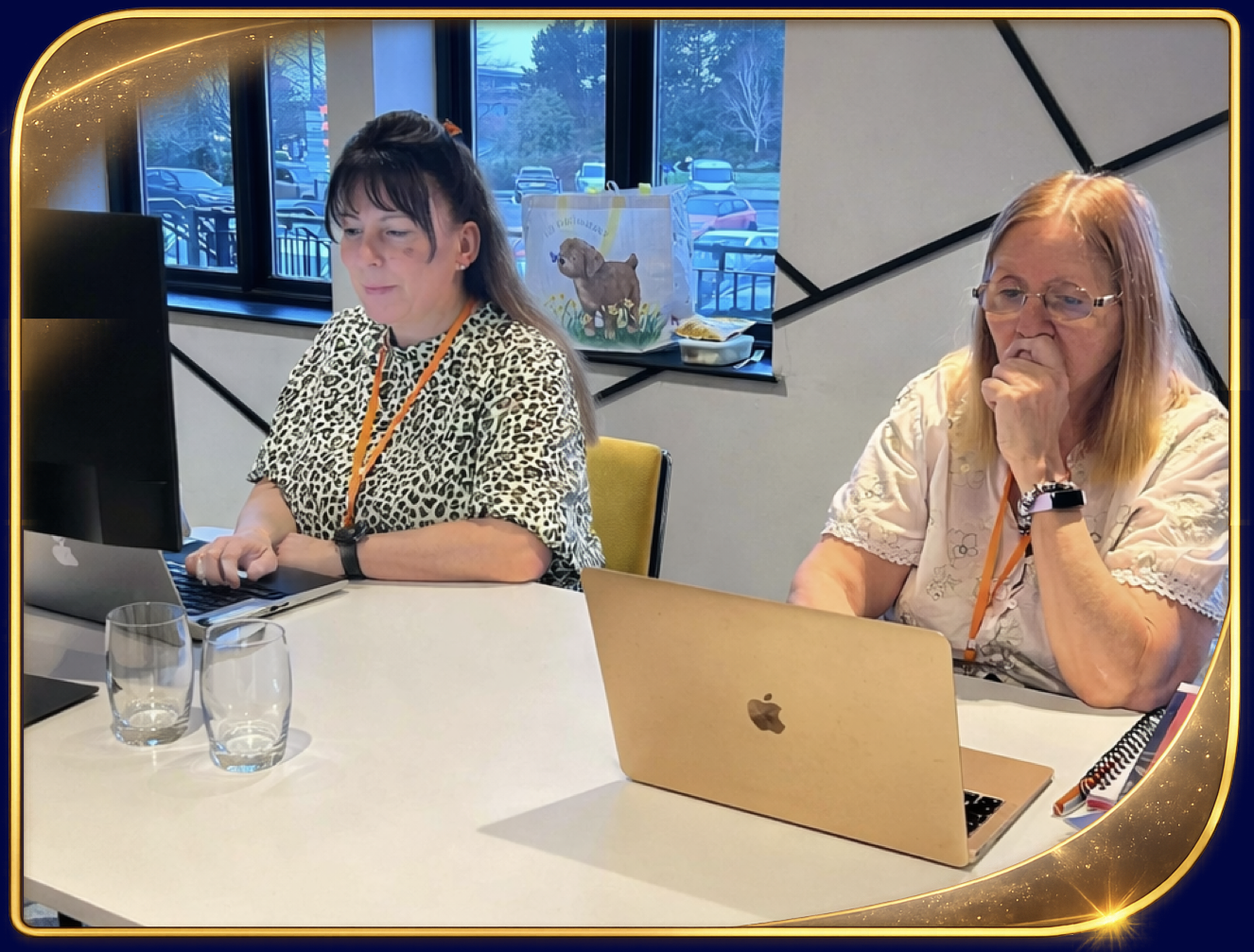 Debby and Sue working on their businesses at the in person training event