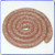 Raw Wardynski fresh Polish sausage coil on white background