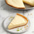 Florida Fresh Key Lime Pie with one slice removed, featuring a smooth, creamy Key lime filling in a golden graham cracker crust.
