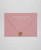 Dusty Pink wedding invitation envelopes with white ink addressing and a wax seal