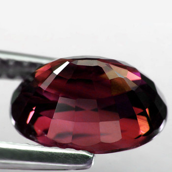 8x5.5 mm Oval {1.42ct} Top Fire Natural Unheated Intense Orange Pink Zircon (Red Flashes) [Flawless-VVS]