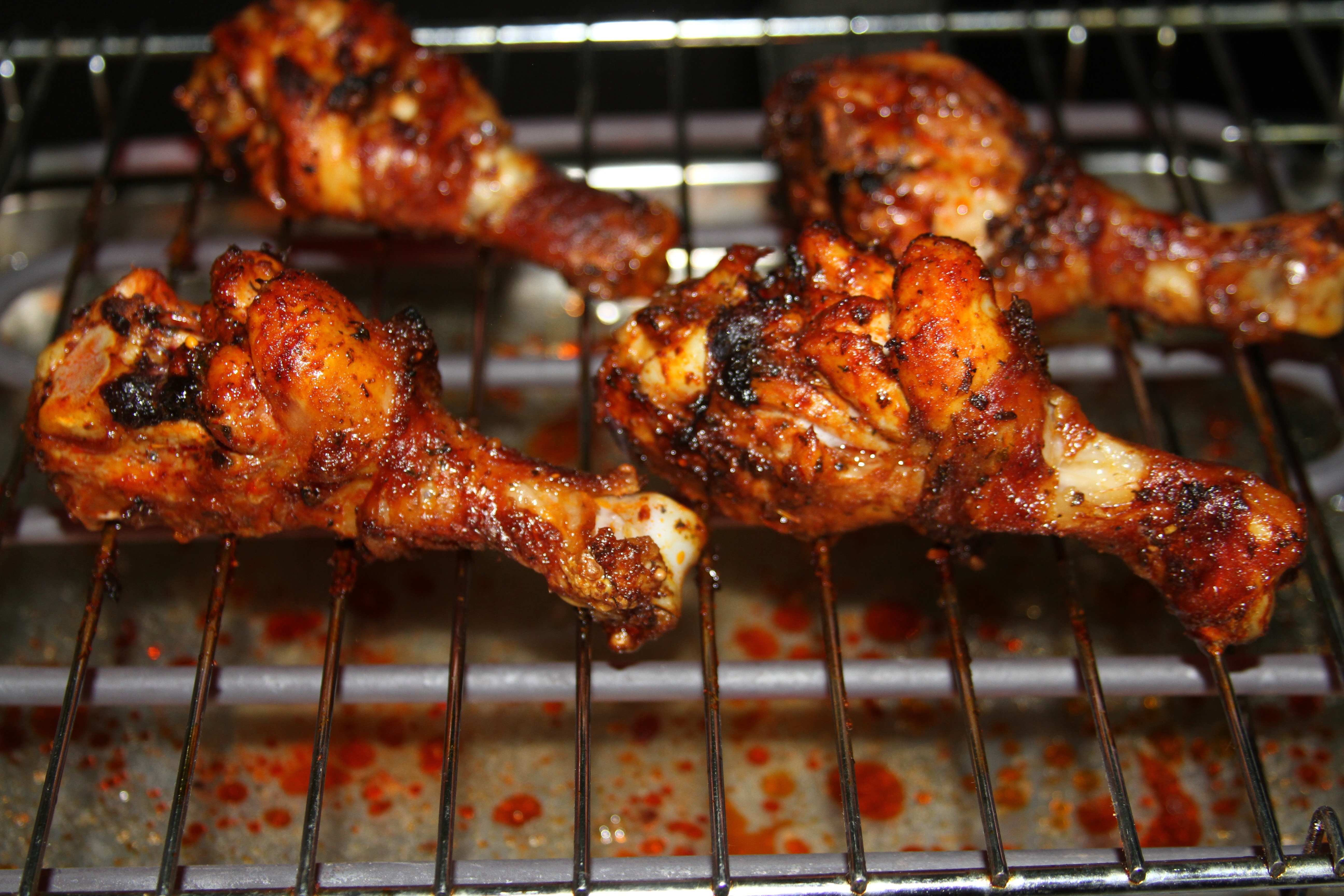 Smoky BBQ chicken thighs on the grill
