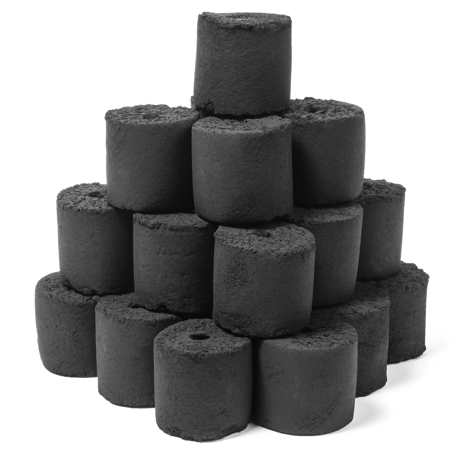 Stacked coconut shell charcoal cylinders on a white background