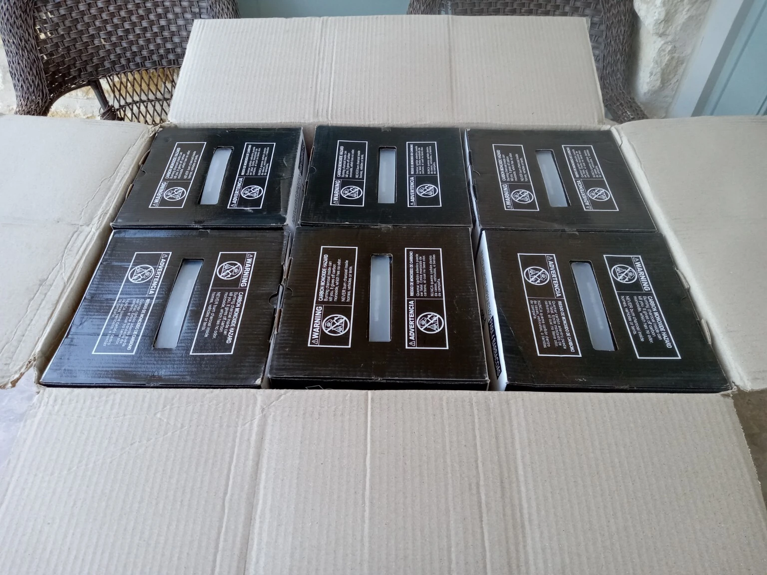 Open COCO-BBQ box showing individually wrapped charcoal packs