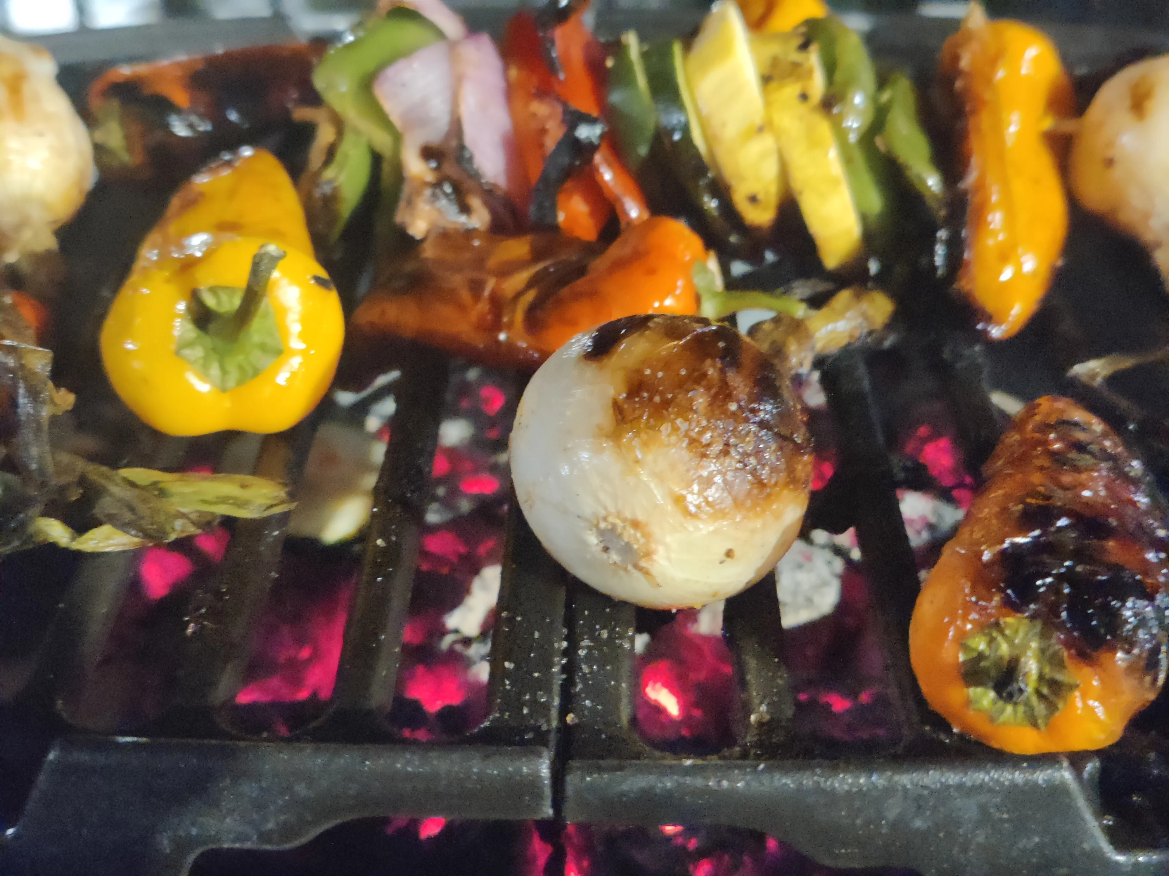 Charred vegetable skewers on the grill