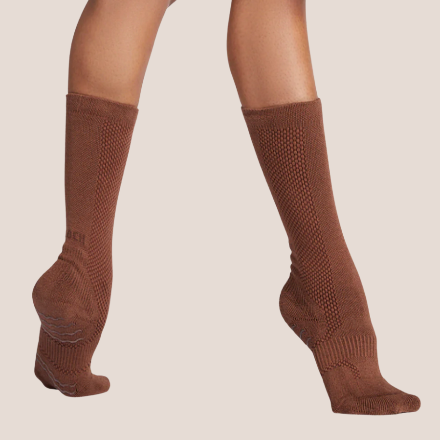 Brown dance socks on releve