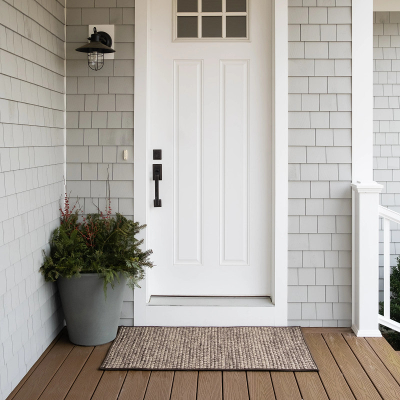 Gray Jute Rug in Front of White Front Door with X Trim