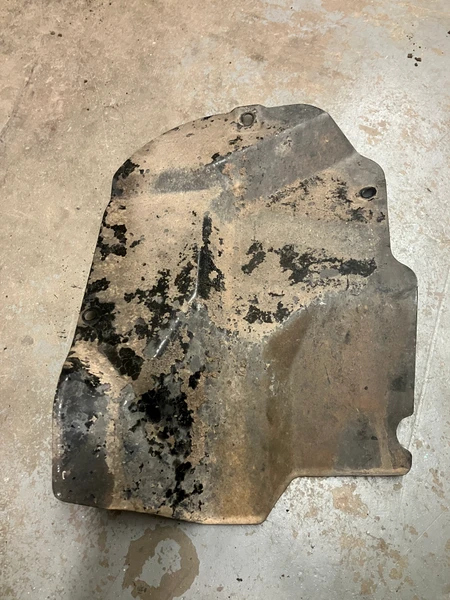 USED - MONTERO Gen 2 - Rear Wheel Well / Fuel Tank Shield, Left
