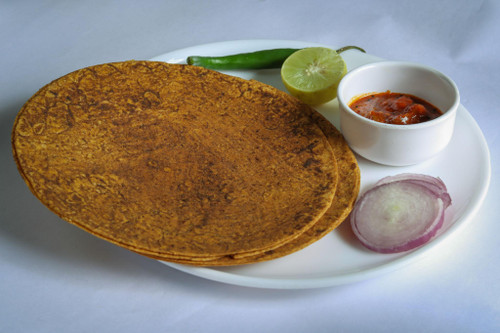 Crispy, roasted whole wheat flatbread seasoned with traditional Indian spices — a flavorful tea-time snack that’s baked, not fried.