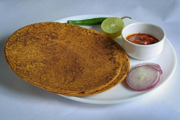 Crispy, roasted whole wheat flatbread seasoned with traditional Indian spices — a flavorful tea-time snack that’s baked, not fried.