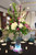 This tall vibrant  peacock jewel tone centerpiece with have your guests in Awe. The bold colors and Led base makes this stand out from the rest. We rent out the Led Base and The large cylinder this flowers sits on.

We can add more flowers and or peacock feather to add more details to your centerpiece. The price for this style centerpiece starts at 180.00 
