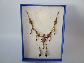 Vintage Bess gold-toned necklace and matching earrings with simulated gemstones in original presentation box.