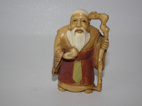 Antique Japanese netsuke of Jurōjin holding a peach with staff, signed hand-carved figurine, 5cm tall