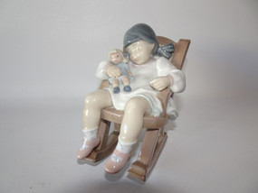 Lladro 5448 Naptime figurine by Jose Puche, porcelain girl with doll in rocking chair, 12cm tall