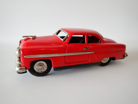 Vintage Japanese tin litho Ford Crestliner friction motor toy car in red, 17.5 cm long