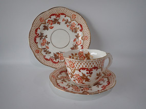 Antique Coalport attributed bone china trio with Imari-inspired red and gilt decoration, circa 1890.