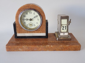 Art Deco marble desk clock with matching chrome-tone perpetual calendar on rectangular marble base, circa 1920s–1930s.