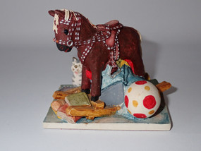 1989 Peter Fagan Rocking Horse HS625 surrounded by colourful childhood toys from the Home Sweet Home Collection.