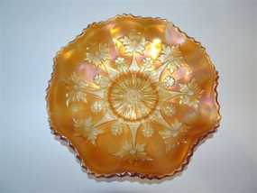 Fenton carnival glass apricot bowl in a little flower pattern circa 1910.