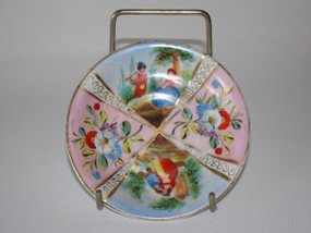 Rare Holzapfel and Greiner hand painted dish with a courting scence and floral desing, dated 1799-1817.