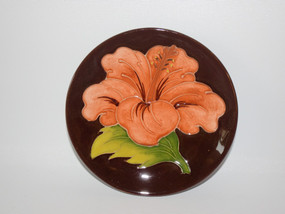 Moorcroft dish in a brown glaze and hibiscus design dated 1960-1970