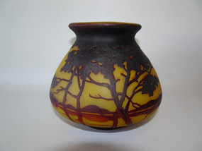 Stunning Muller Fres Luneville cameo glass vase decorated with landscape of trees, lake and hills in tones of orange and brown.