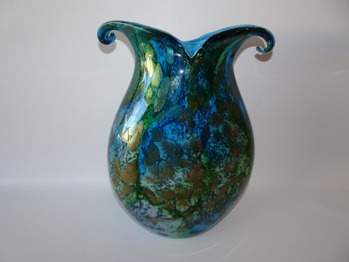 This  stunning  art glass oceanic vase with loved rim and aventurine inclusions would make the perfect addition to any home space.  In beautiful shades of blue and purple it will bring to life any area in you home.