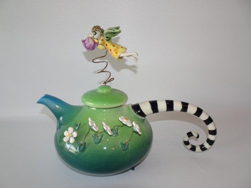 Discover the enchanting Marion Mewburn vintage teapot with an angel, a delightful masterpiece in vibrant colors standing at 28cm long.