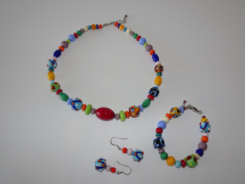 Laila Murano glass necklace, bracelet and earrings set with colourful millefiori-style beads in red, blue, green, yellow and orange