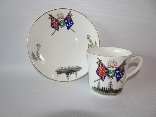 Samuel Radford WWI commemorative teacup and saucer featuring Union Jack and Australian flags celebrating HMAS Sydney and SMS Emden naval battle