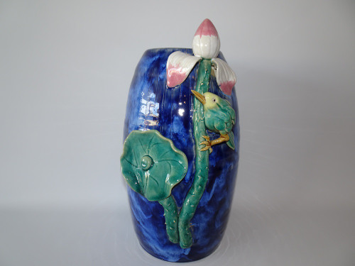 Chinese Shiwan pottery vase with relief bird perched on lotus stem in blue and green glazes