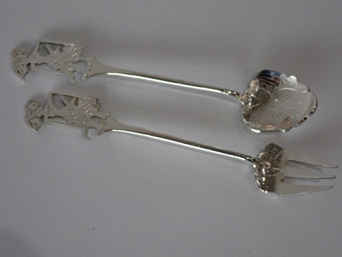 Boxed set of twelve Indonesian Yogya 800 silver Wayan cocktail spoons and forks with original certificate, circa 1950–1980.