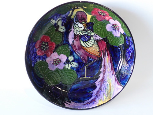 Art Deco Phoenix Ware hand decorated centrepiece bowl by Ronald Dean for Thomas Forester & Sons featuring a Bird of Paradise amongst blackberry blossoms with vibrant tube-lined enamels.