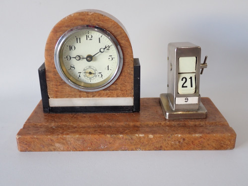 Art Deco marble desk clock with matching chrome-tone perpetual calendar on rectangular marble base, circa 1920s–1930s.