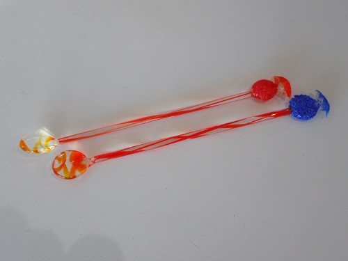 Pair of vintage Murano style glass cocktail swizzle sticks with colourful candy finials and teardrop-shaped scoops.