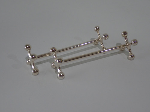 Pair of vintage Christofle French silver-plated four-ball knife rests circa 1940s, measuring 8.5 cm long.