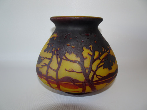 Antique Muller Frères Lunéville cameo glass vase with amber-yellow background, brown acid-etched trees, woodland landscape and flared neck.