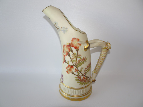 From the Royal Worcester factory comes this lovely jug painted with sprays of flowers and antler style handle dated 1895.